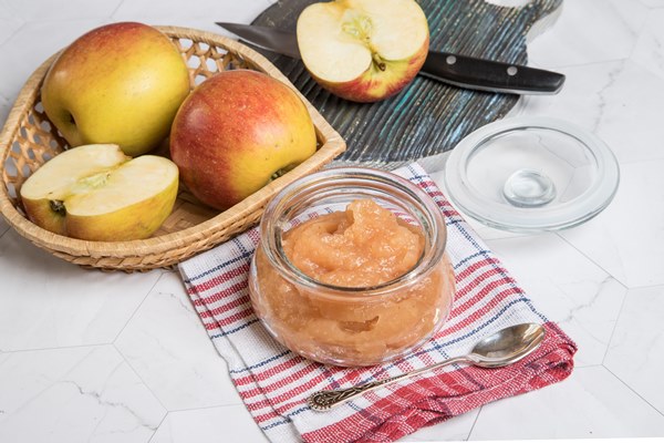 apple puree in a glass jar and fresh apples on a light background close up horizontal orientation - Майонез домашний «Яблочный»