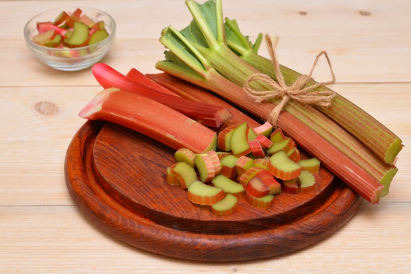 chopped rhubarb on a cutting board - Пирог с ревенем