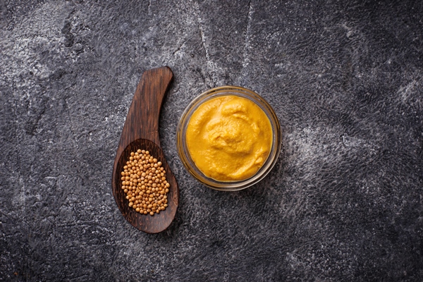 mustard and seeds on concrete background selective focus - Маленькие хитрости приготовления пищи