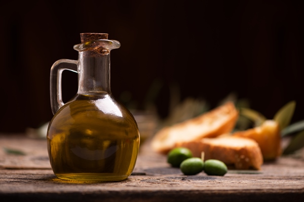 olive oil with bread on a wooden table rustic vintage composition - Постный майонез