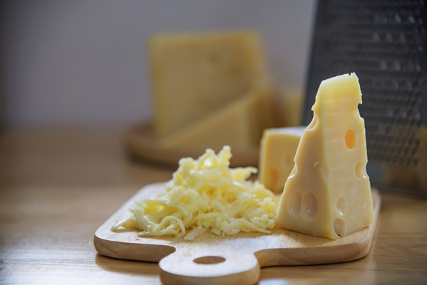 beautiful cheeses in the kitchen cheese food preparing concept - Запеканка из кабачков и цветной капусты