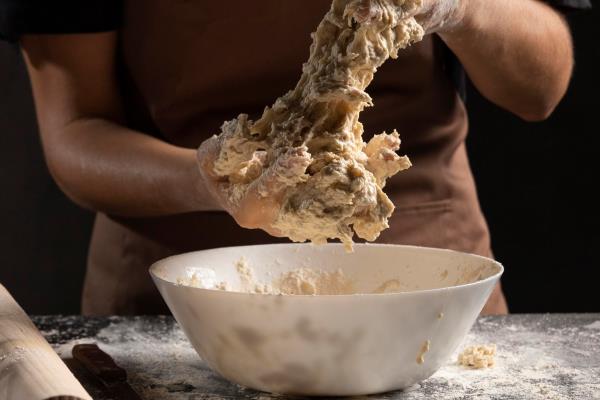 chef mixing dough with hands 1 - Кулич (пасха) казацкий старинный