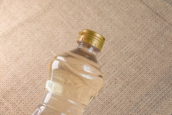 container of vinegar on the brown background - Грибы натуральные консервированные