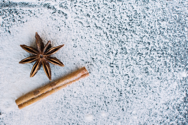 elevated view of star anise cinnamon stick and flour - Постные тыквенно-миндальные блины