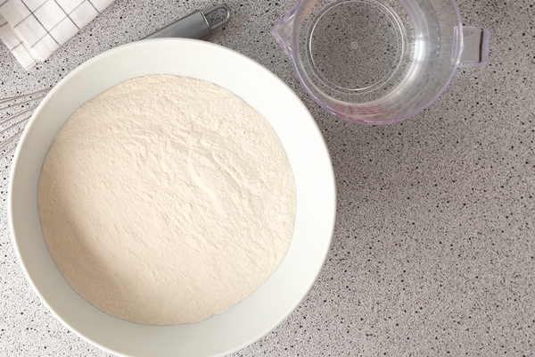 flour egg and water in kitchenware on grey table - Постные блины "Простые"
