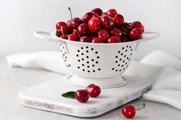 front view of delicious cherries concept - Консервированная вишня с косточками