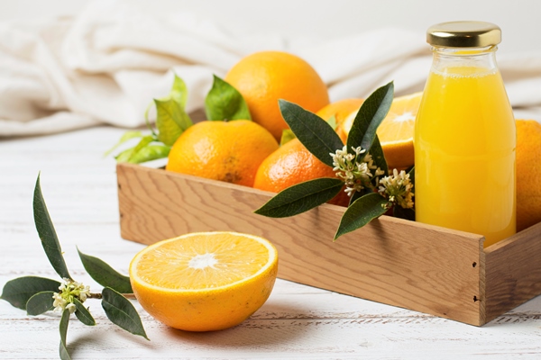 front view oranges and juice in wooden - Мороженое апельсиновое