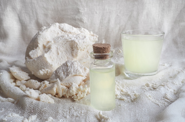 milk serum and natural cottage cheese on gauze - Пасха с кедровыми орешками и кокосом