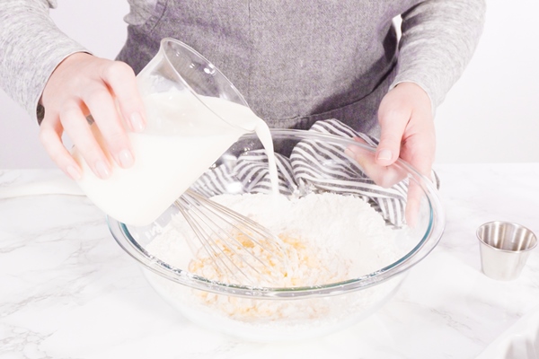 mixing ingredient in a glass mixing bowl to make the crepes batter 1 - Постные блины из миндальной муки
