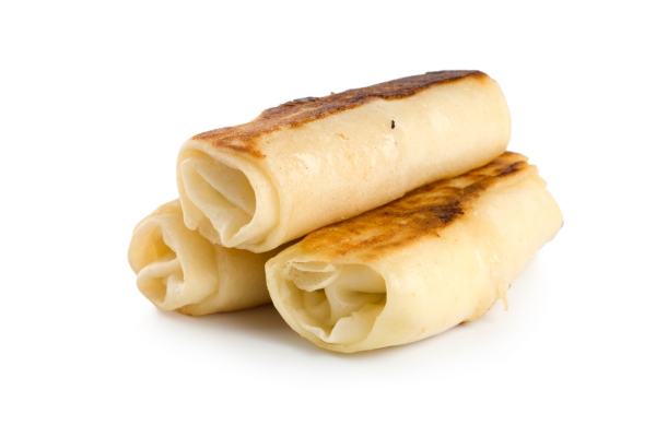 pancakes with cottage cheese isolated on white background - Постные блинчики с морковной начинкой