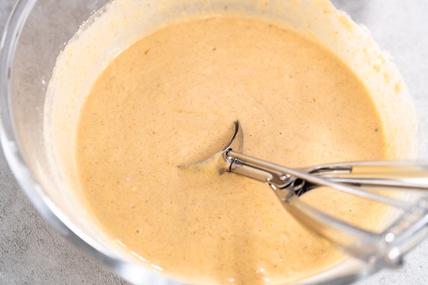 pumpkin pancakes batter in a glass mixing bowl - Постные блинцы на яблочном пюре