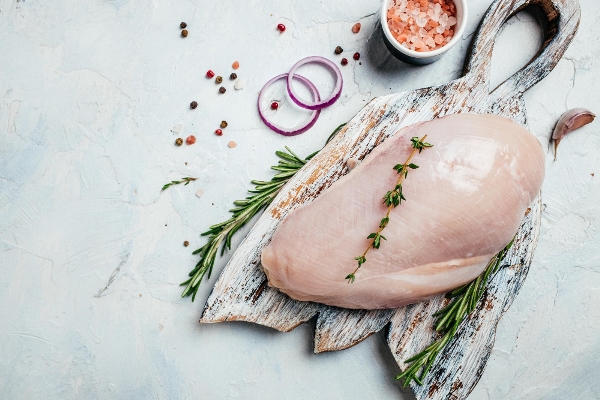 raw turkey fillets on cutting board with spices and herbs cooking ingredients banner menu recipe place for text top view - Особенности диеты при аллергических заболеваниях