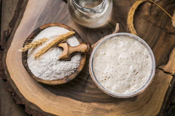 the leaven for bread is active starter sourdough fermented mixture of water and flour to use as leaven for bread baking the concept of a healthy diet - Пасхальный кулич