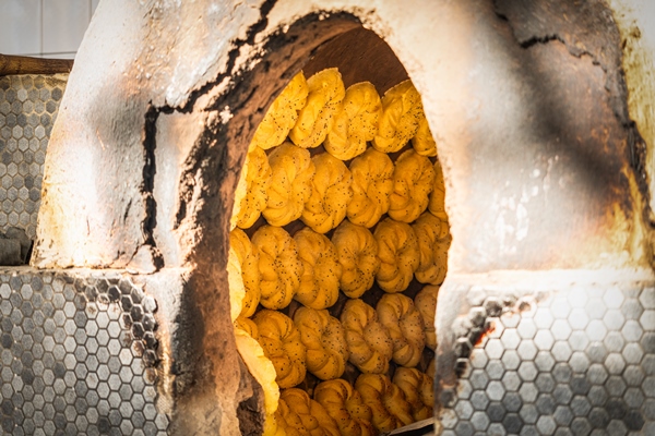 uzbek flatbreads made of raw dough are baked in a hot tandoor the national cuisine of uzbekistan process of making bread in the oven - Библия о пище