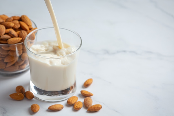 almond milk with almond on marble background - Постная гречневая каша
