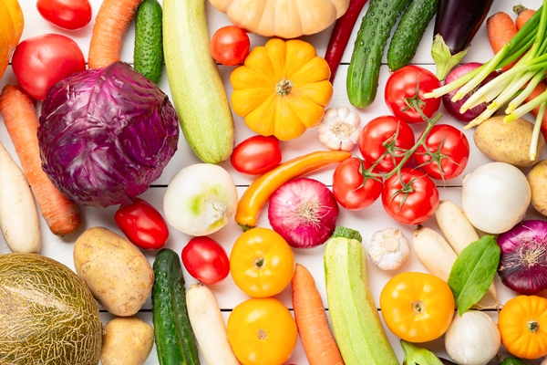 assortment of fresh vegetables as a background seasonal close up farmer table with vegetables pumpkins tomatoes cabbage carrots onion cucumber melon eggplant potatoes and other - Картофельное рагу с овощами