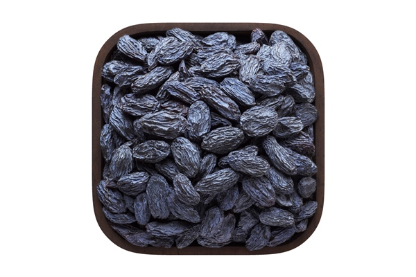 blue raisins dried grapes in square bowl isolated on white background organic food top view - Тушёный картофель с черносливом и изюмом