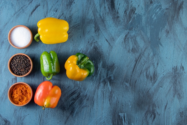 fresh colorful organic peppers and condiments on blue background - Баклажаны с красным сладким перцем, постный стол