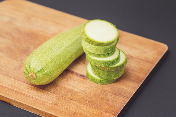 fresh raw green courgette or zucchini whole and sliced - Кабачковая икра