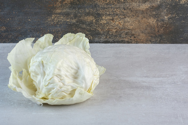 fresh white cabbage on stone table high quality photo - Овощные голубцы