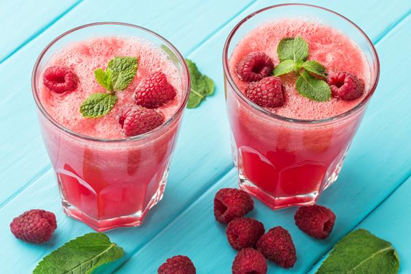 high angle of glasses with watermelon cocktails and mint - Квас из малинового сока