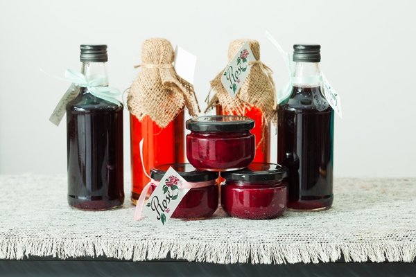 homemade rose petal jam and berries syrup in bottles - Салат из моркови и сладкого горошка