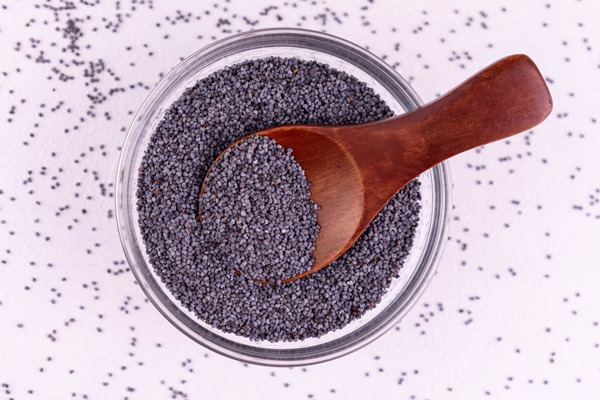 poppy seeds in a plate on a white background flat lay - Штрудели с маком