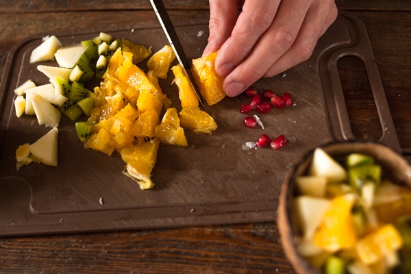 preparing of fruit salad in coconut shell - Фруктовый салат, постный стол