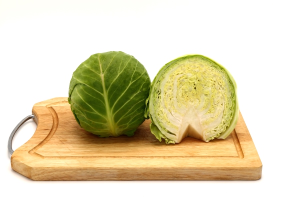 sliced head of cabbage on a cutting board isolated - Грузинский салат (без масла)