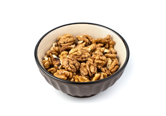 walnuts in a brown plate on a white background - Грузинский салат (без масла)