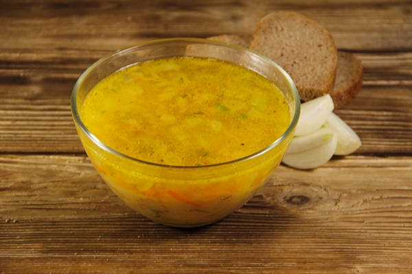 fresh pea soup in glass bowl on wooden table - Суп гороховый