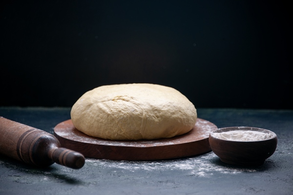 front view fresh raw dough on dark cake pie color cooking bake biscuit dough - Постный овсяный хлеб
