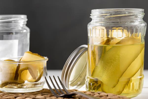 front view of pickled cucumbers in glass jars 1 - Суп-рассольник с перловкой