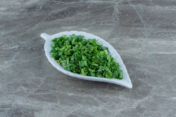grated greens on the platter on the marble table - Похлёбка из свежих грибов по-нижегородски