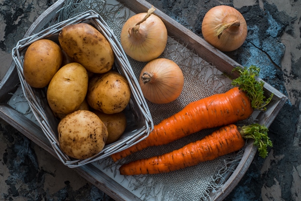 mixed vegetables potatoes carrots and onions in a basket cooking vegetarian food - Суп гороховый