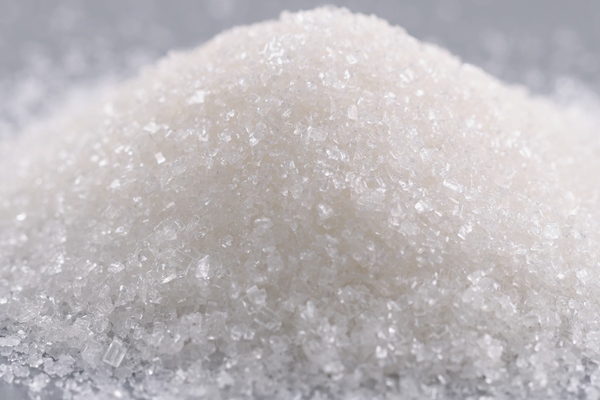 pile of sugar crystals on grey surface focus on heap of sweet powder to add in dishes - Сладкий квас