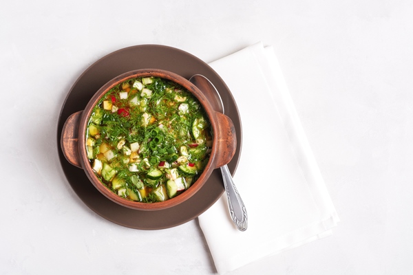 russian summer okroshka with bread kvass is in a clay cup - Воронежский квас для окрошки