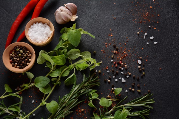 spices and herbs on dark stone background - Суп перловый с репой