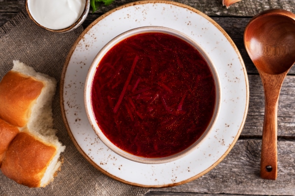 tasty borsch pampushkas traditional ukrainian cuisine red soup beet potato meat carrot cabbage and garlic top view closeup - Борщ свекольный с перловой крупой