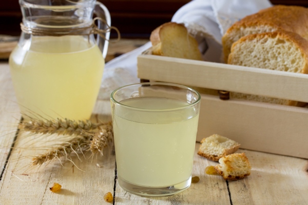 traditional russian cold drink light kvass on the kitchen table in a rustic style - Квас на опаре