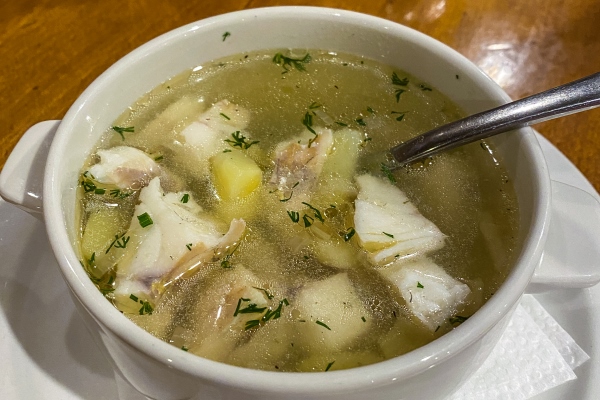 traditional russian ear dish fish soup ukha from zander with pieces of fish close up - Уха двойная