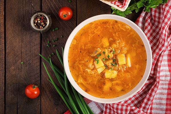 traditional russian soup with cabbage sauerkraut soup shchi flat lay top view - Щи с яблоками и помидорами