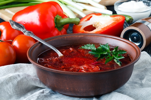 traditional ukrainian russian vegetable borscht soup on the old wooden surface - Борщ из жареной свёклы
