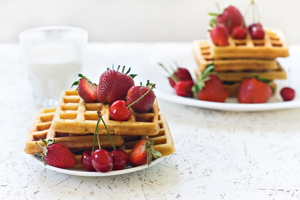 breakfast waffles with strawberries and cherries and milk on a white plate - Готовим фруктовые шашлычки месте с детьми