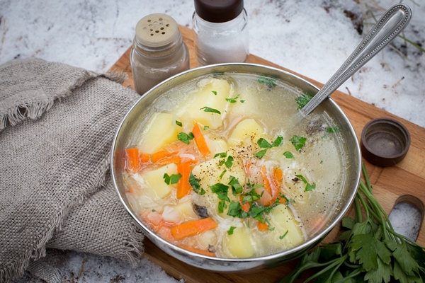 fresh fish soup with spices cooked over a fire taken on the nature of the fish soup - Рыбный бульон из костей, голов и хвостов