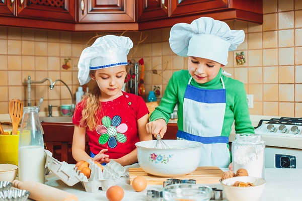 happy family funny kids are preparing the dough bake cookies in the kitchen - Как научить ребенка готовить?