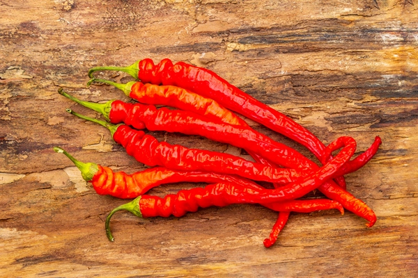 red and orange chili pepper with garlic cooking - Постная аджика острая