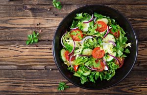 salad from tomatoes cucumber red onions lettuce leaves healthy summer vitamin menu vegan vegetable food vegetarian dinner table top view flat lay - Правила составления меню