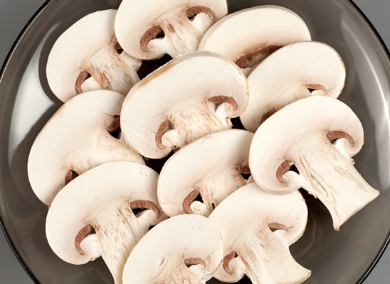 sliced a a a a a a mushrooms stacked on a plate - Грибы жареные, постный стол