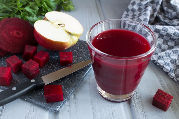 beetroot and apple juice on the grey cutting board - Морс из свёклы